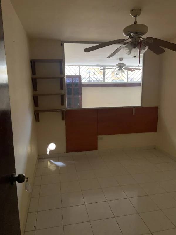 Bedroom with ceiling fan and tiled floor in foreclosure apartment PH Altos de Bella Vista Panama