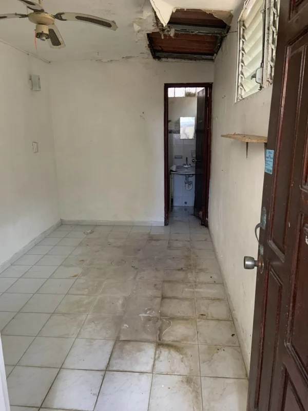 Second bedroom with ceramic tile floors and window in apartment PH Altos de Bella Vista Panama