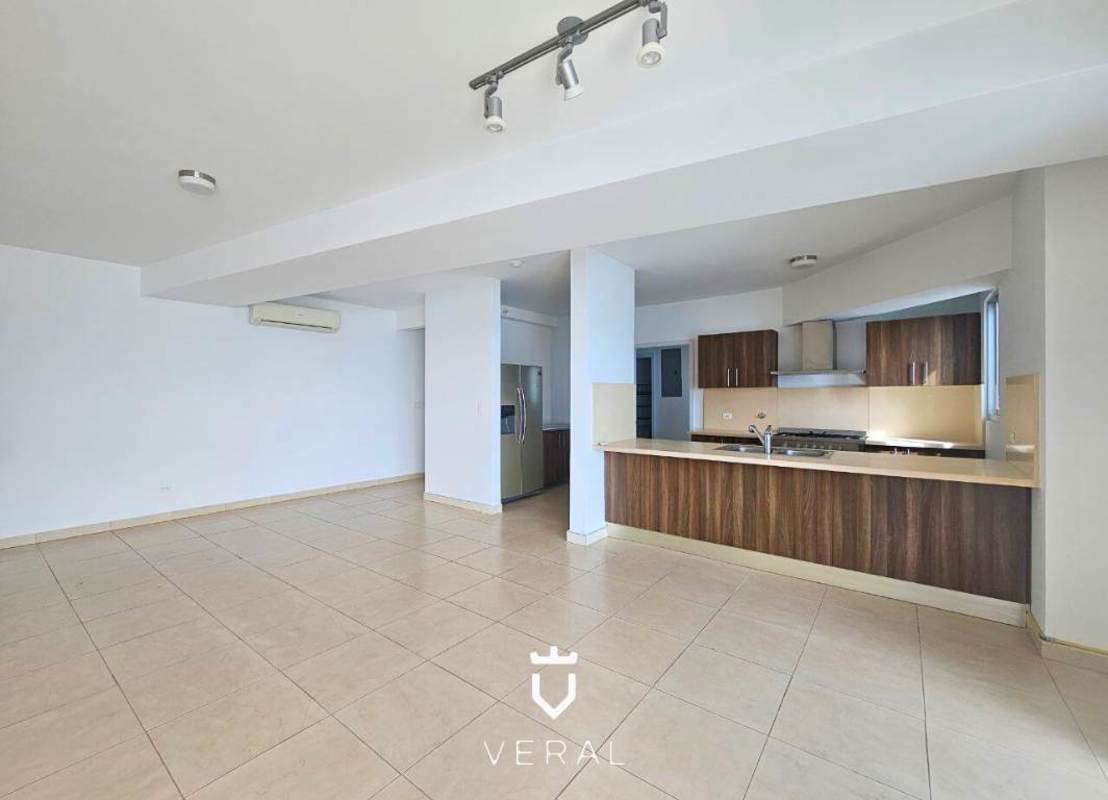 Contemporary kitchen with granite countertops, double sink and city views at PH Oasis on the Bay Panama