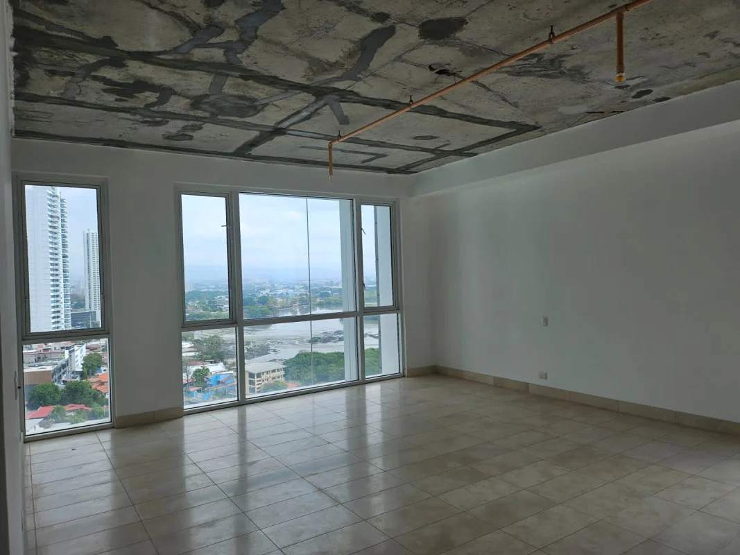 Modern infinity rooftop swimming pool with lounge chairs and bay view in PH Santorini Coco del Mar Panama City