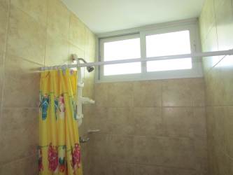 Living area with access to oceanfront balcony at PH Playa Serena Gorgona Panama