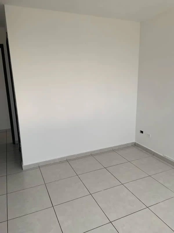 Living room and dining area with ocean view and balcony access in PH Bay View Panama City