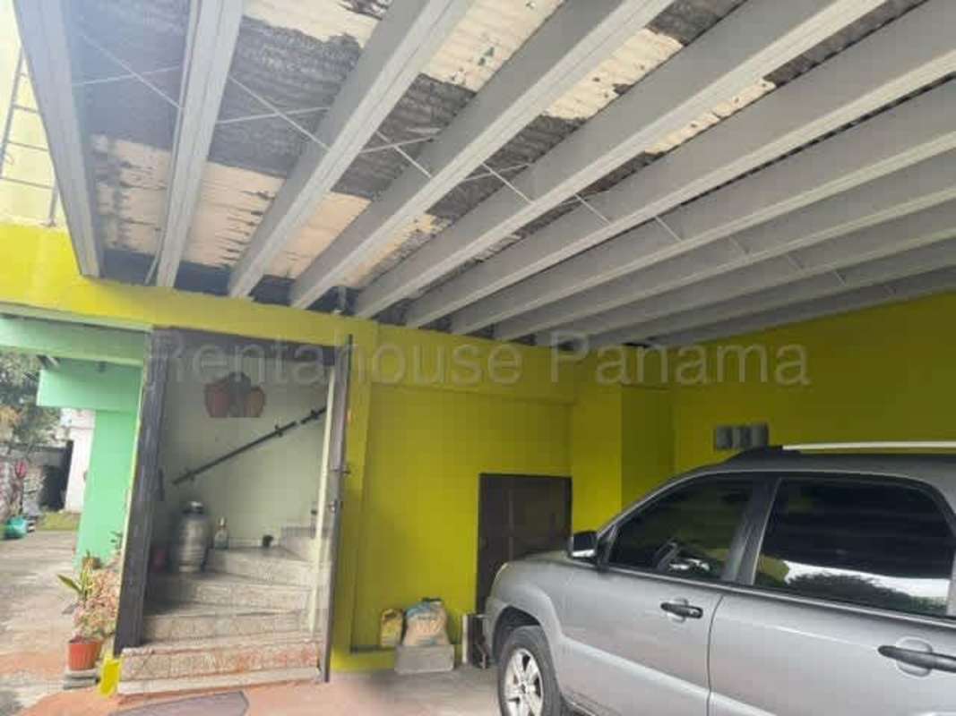 Dining room with large table, ceiling fan, windows Rio Abajo Panama