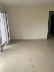 Kitchen with granite countertops, dark cabinetry, open layout PH Midrise Panama Pacifico