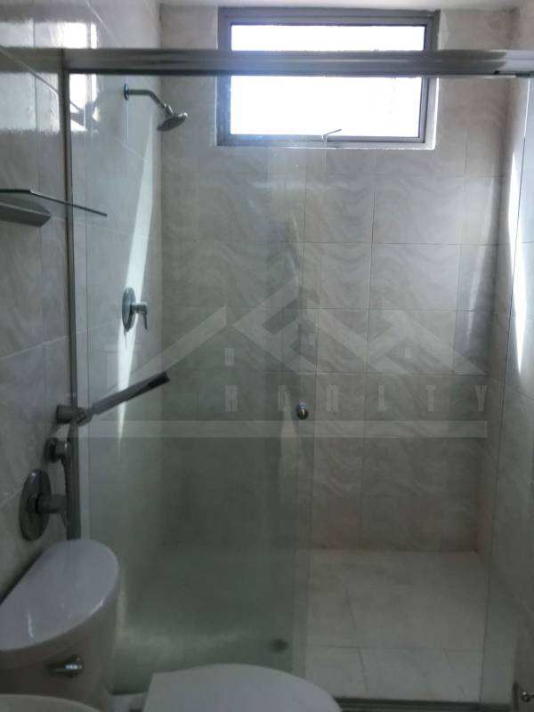 Modern covered children's play area with trampoline, playground toys in Villa de las Fuentes apartment Panama