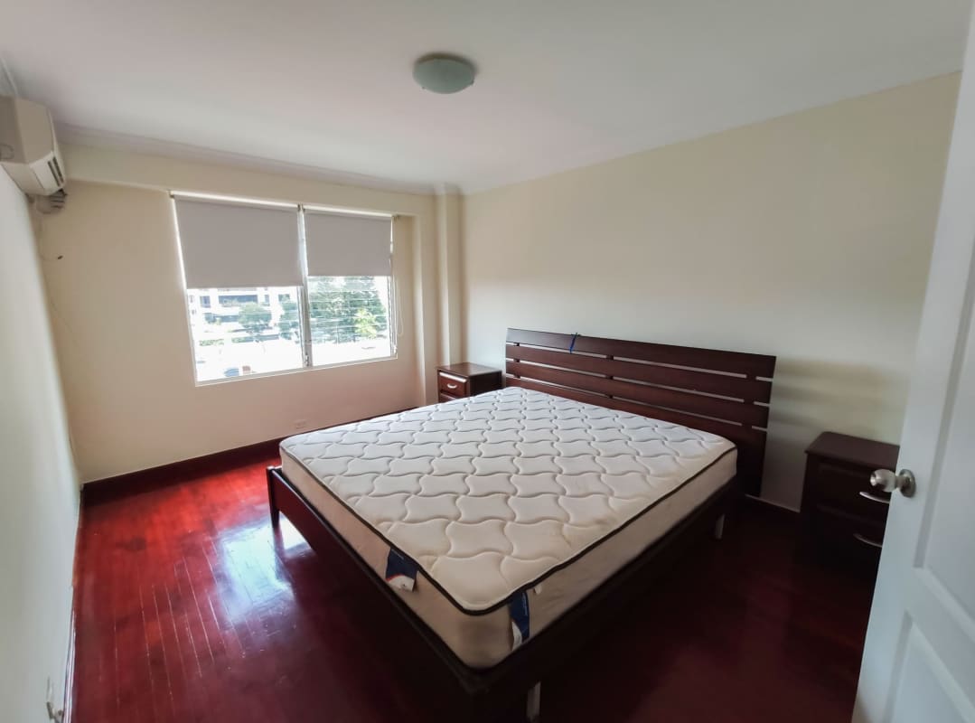 Spacious bedroom wood floors large window Punta Paitilla apartment sale