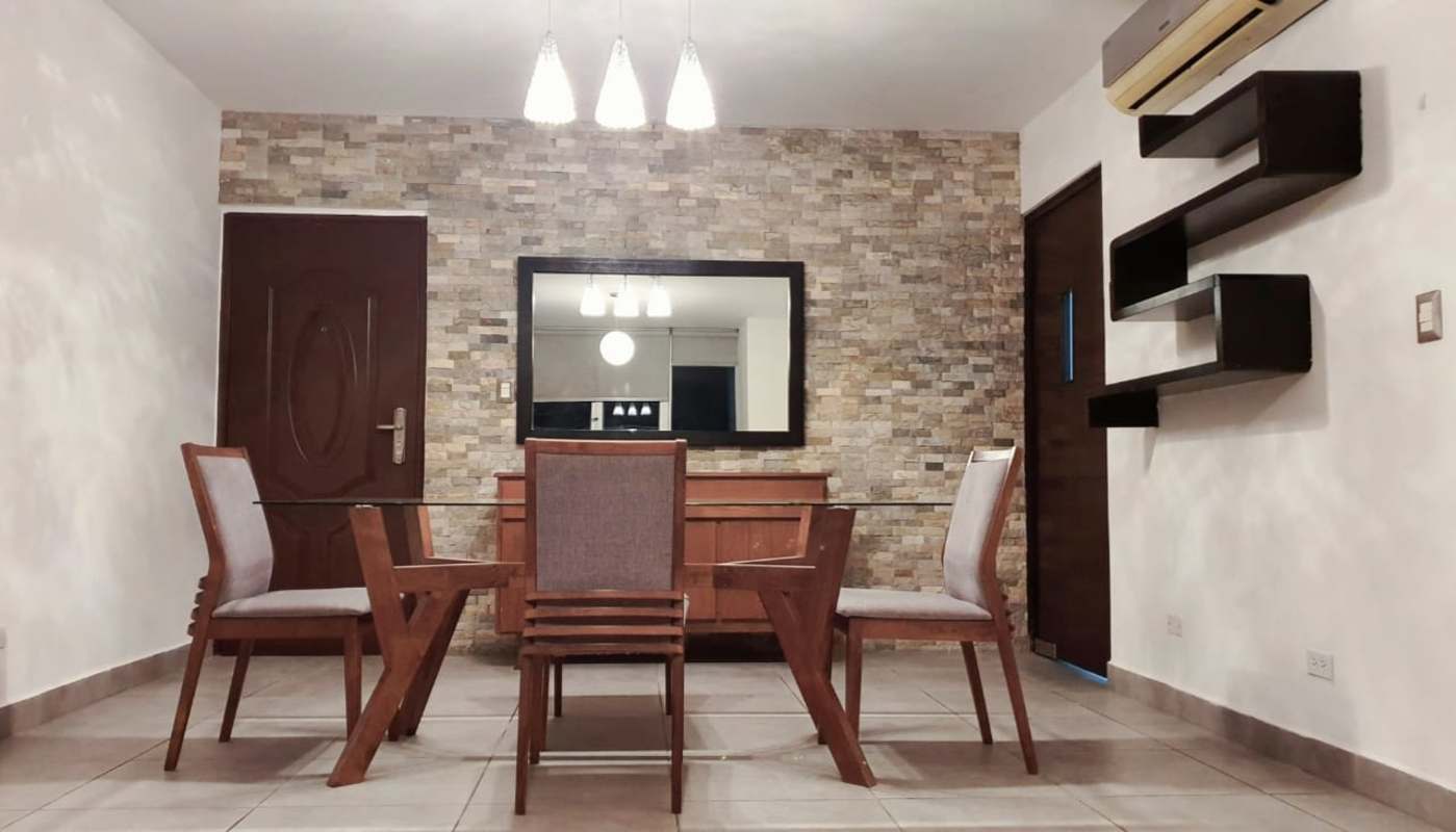Modern dining room with stone wall glass table AC at Crystal Hills Villa de las Fuentes Panama