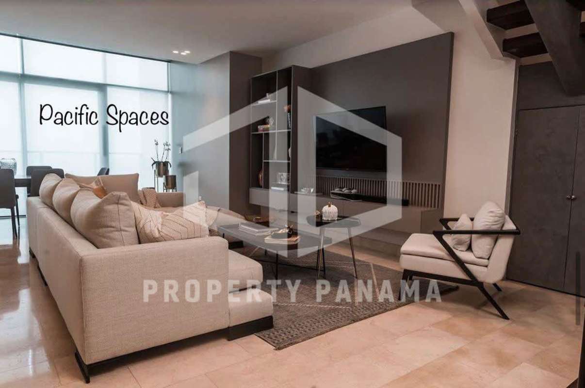 Open concept living room with large windows and city views in PH Pacific Village Panama