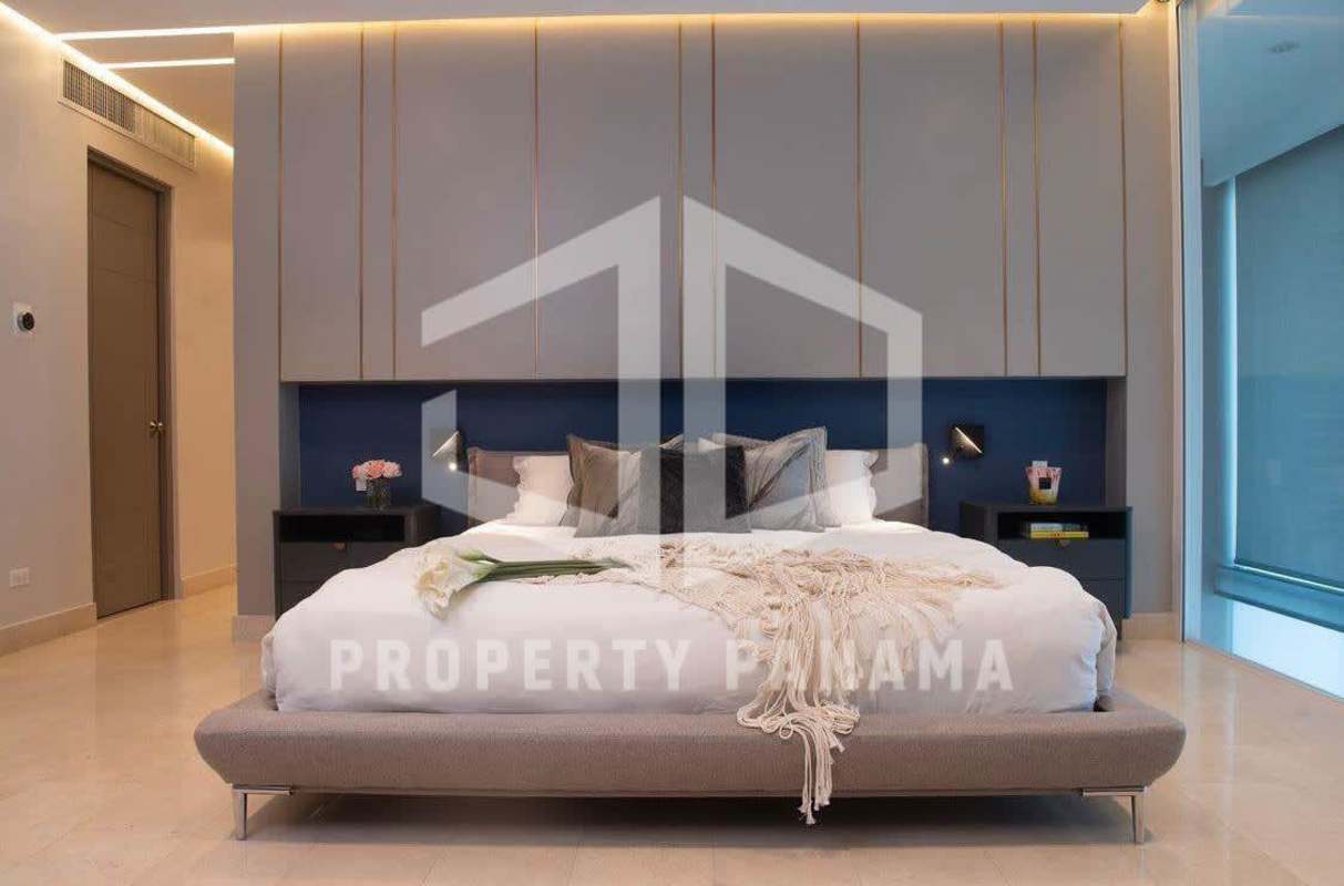 Modern dining area with glass walls and ocean view balcony Punta Pacífica PH Pacific Village