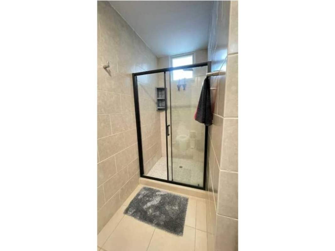 Bright living area with sectional sofa and balcony at PH Red Point San Francisco