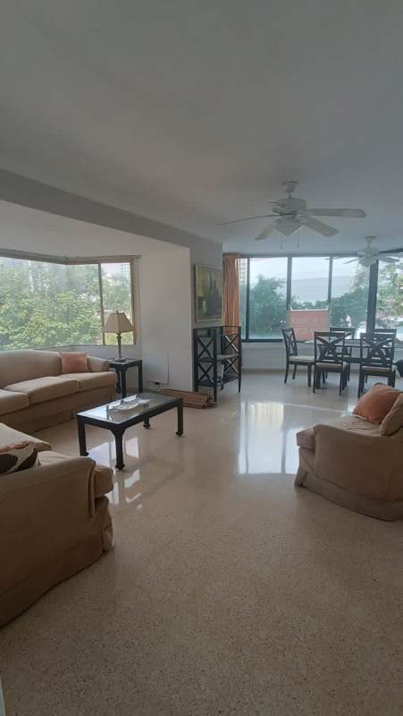 Modern elevator lobby in PH Ipanema with dark panels and armchair in Punta Paitilla