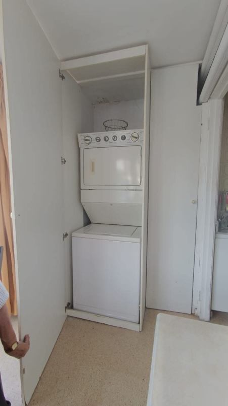 Spacious bedroom with AC, ceiling fan, window view in PH Ipanema rental apartment Punta Paitilla Panama