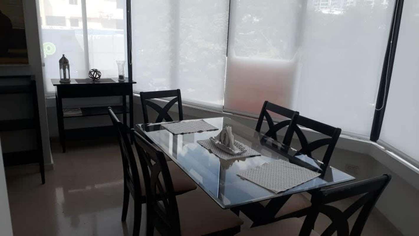 Living room with beige sofas, artwork and large windows Punta Paitilla