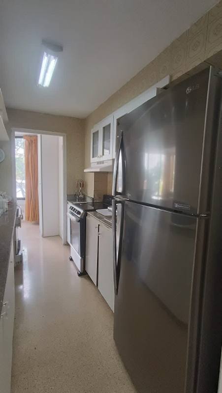 Dining room with glass table black chairs and large windows PH Ipanema Punta Paitilla Panama