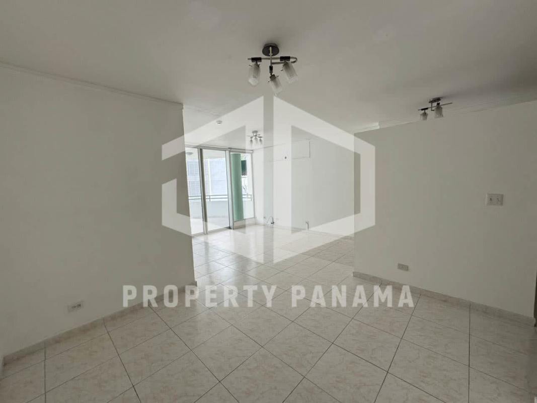 Large bright living dining space tiled floors sliding glass doors balcony PH Deveaux Panama