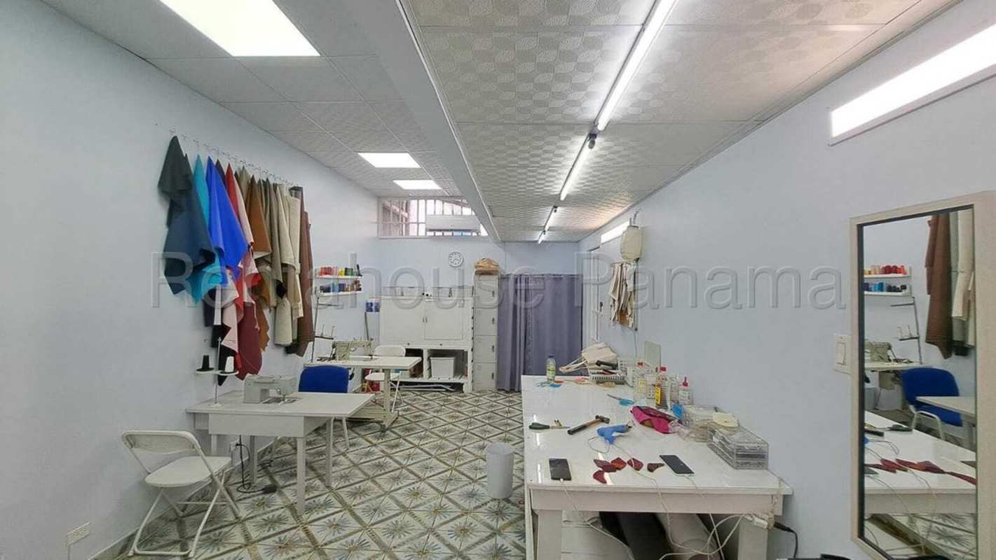 Sewing workshop studio with fabric racks upstairs commercial space Panama City
