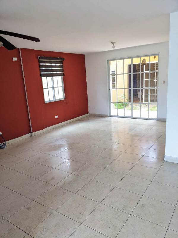 Spacious tiled living room with red wall window access Dorado Lakes Condado Rey Panama