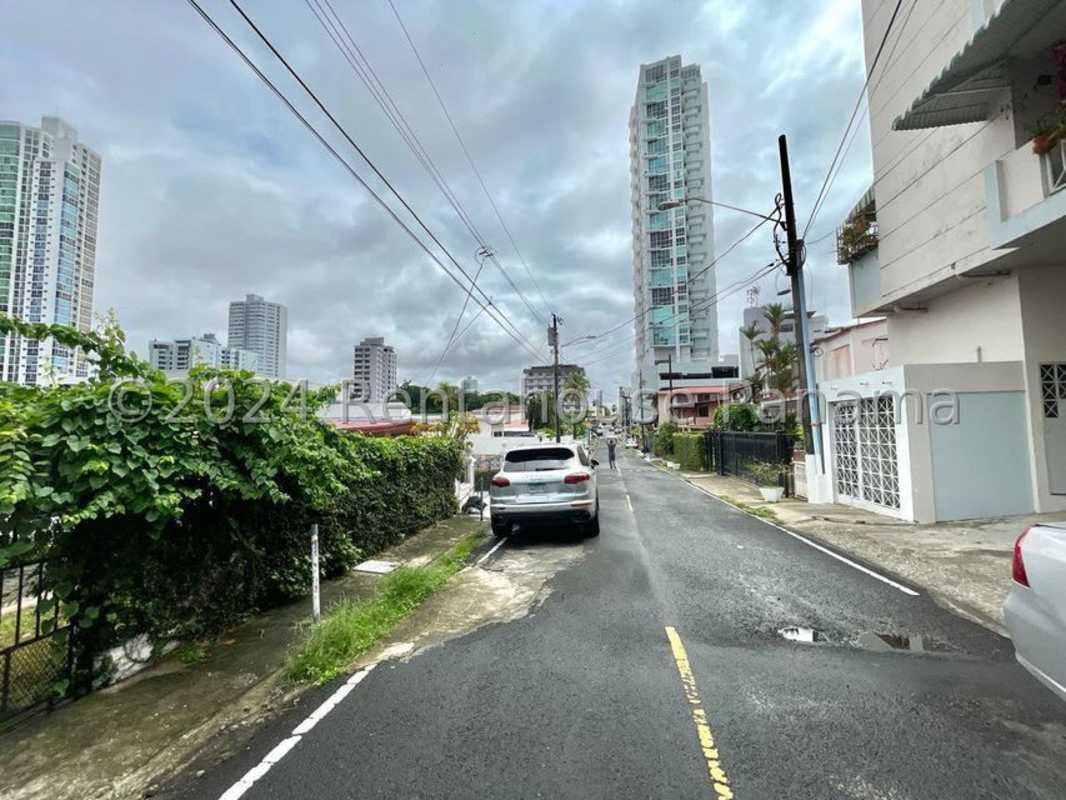 Street scene with buildings and parked cars near commercial property San Francisco Panama