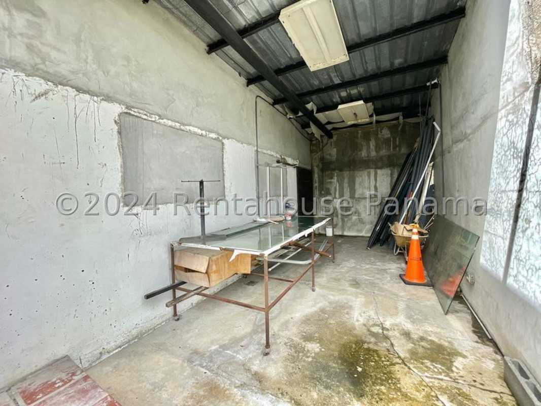 Industrial-style utility room with concrete walls and workbench San Francisco Panama