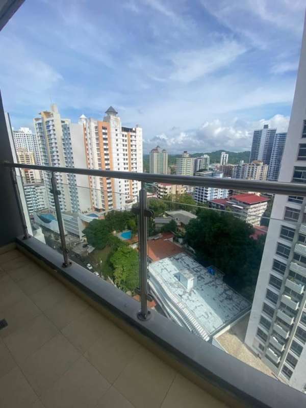 Balcony with glass railing offering panoramic city skyline views at PH Cranc Tower El Cangrejo Panama