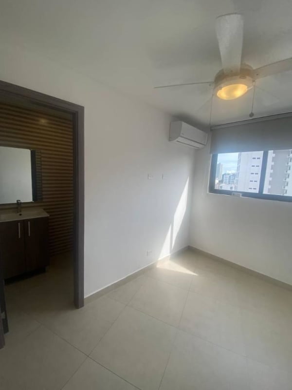 Elegant lobby with modern furniture, chandelier, and accent walls in PH Cranc Tower El Cangrejo Panama