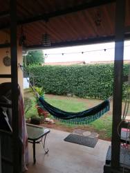 Cozy living room with tile flooring and garden view in house La Arboleda Costa Verde