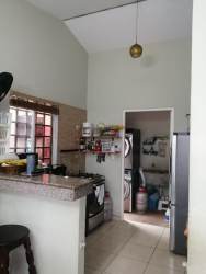 Contemporary bathroom with granite countertop and large mirror family house La Arboleda Panama