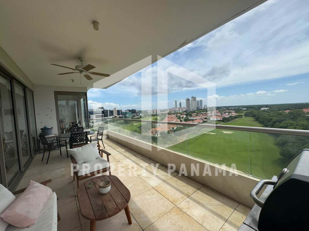 Covered BBQ terrace lounge overlooking water and golf in PH Green Garden Santa María Panama City