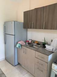 Contemporary kitchen with refrigerator, granite countertop, cabinets in Playa Dorada Vacamonte Panama rental