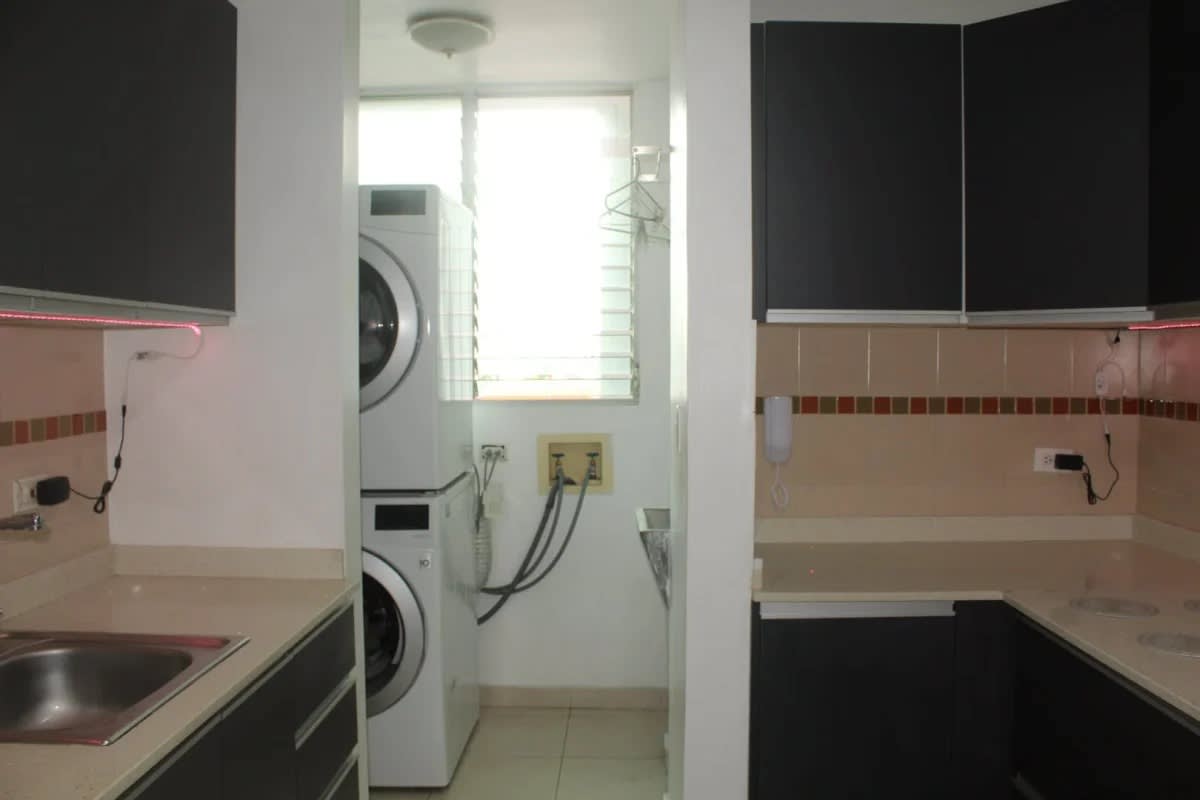Remodeled kitchen with granite countertop, appliances in apartment for sale at PH Vista Balboa Panama City