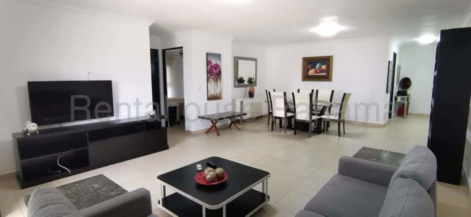 Spacious living dining area with natural light and ceramic flooring in Panama City apartment