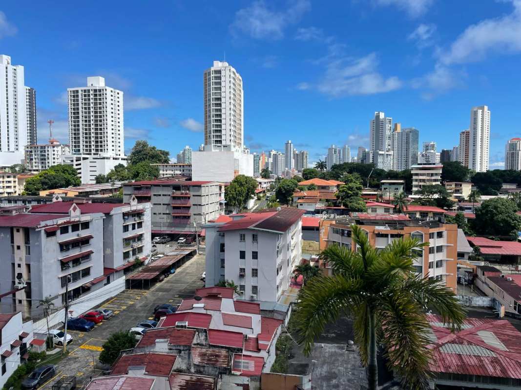 Large terrace with tile floor, seating, planters, kids play structure PH Plaza Valencia Panama