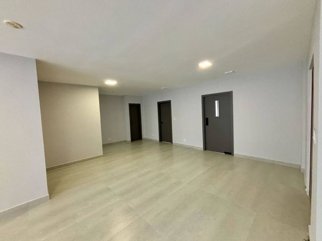 Minimalist modern lobby with tiled floors and doors PH Coco del Mar Panama