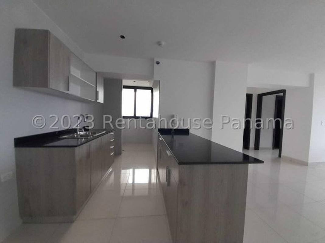 Open kitchen with granite countertop island black accents PH Skyline El Carmen Panama