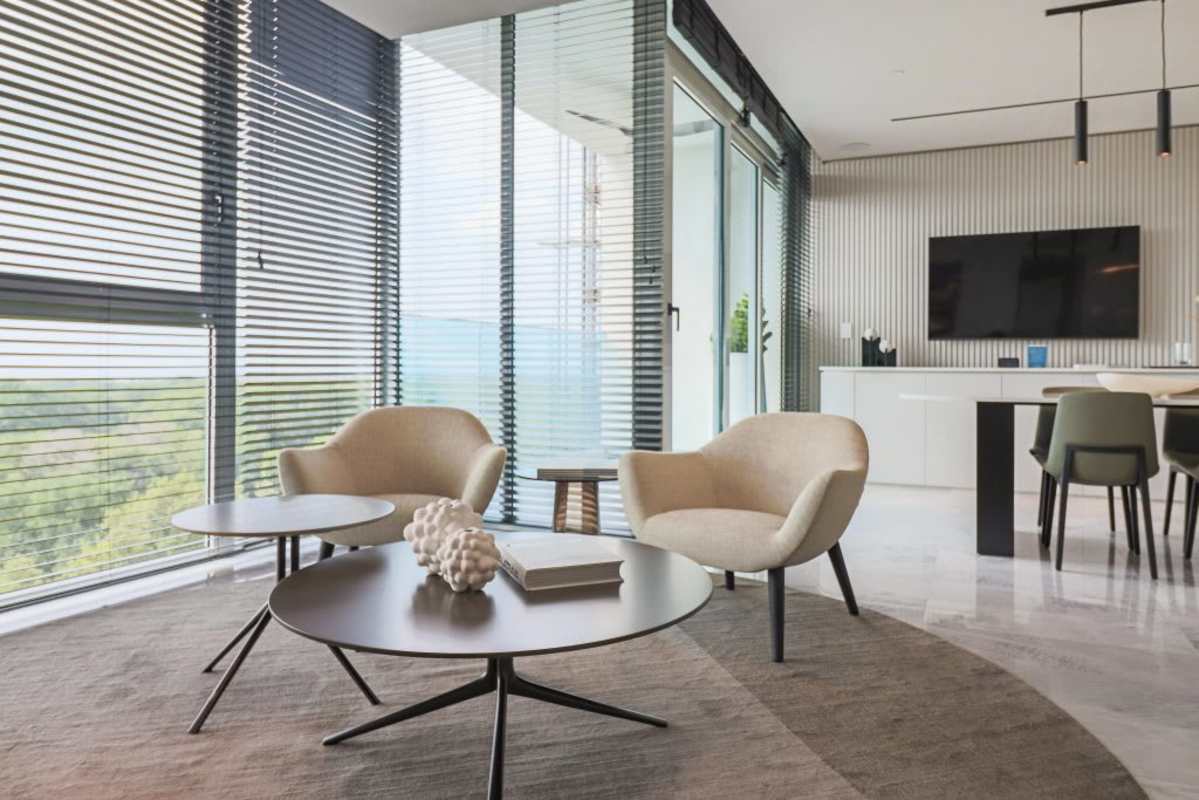 Spacious living and dining area with floor-to-ceiling windows and skyline views at The Ivy Panama