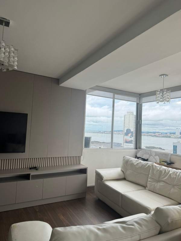 Living room with panoramic sea and city skyline views furnished PH Paitilla Tower Panama