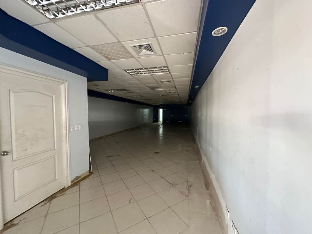 Exterior entrance and storefront glass facade of Pancanal Plaza commercial property in Albrook Panama