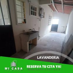 Laundry room equipped with utility sink, windowed walls in Miraflores rental