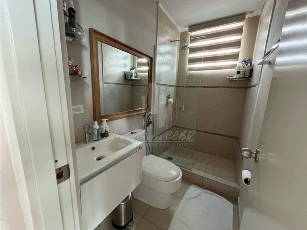 Bathroom with walk-in shower, vanity sink, modern tile in PH Dalí Panama