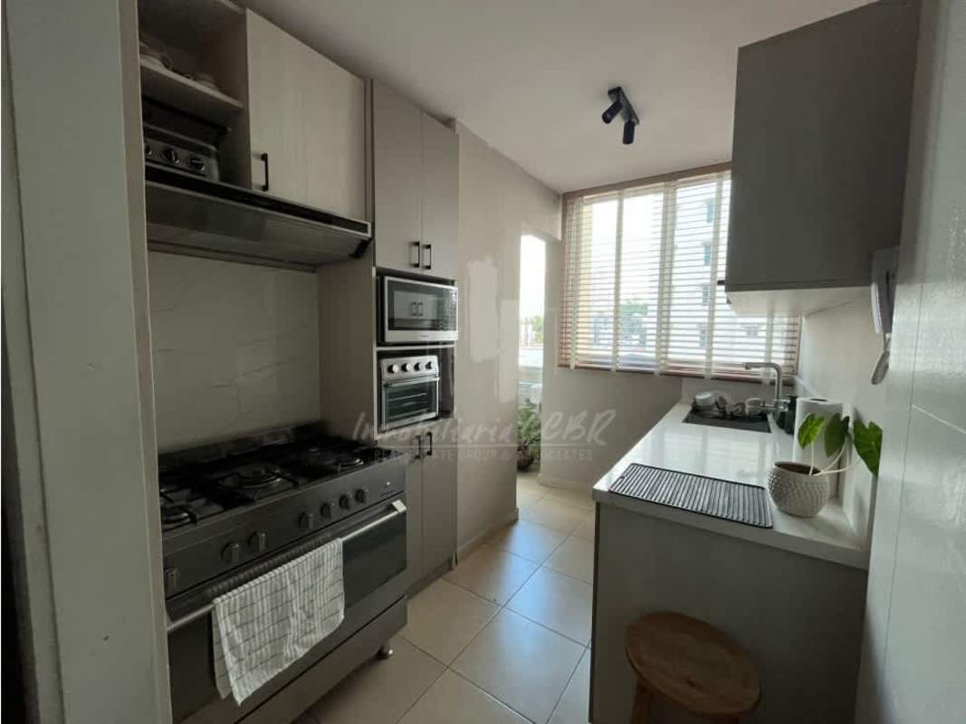Modern kitchen equipped with fridge, microwave, stove PH Dalí Panama Rental