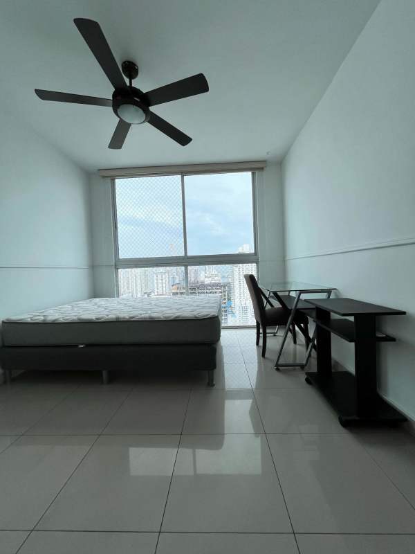 Bright bedroom with panoramic views and minimalist design at PH Titanium San Francisco Panama City