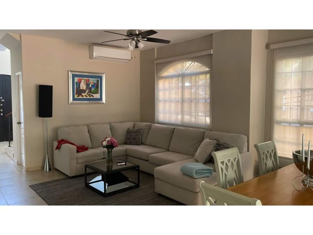 Dining area adjoining bright living room with fan in rental house PH Clayton Village Panama
