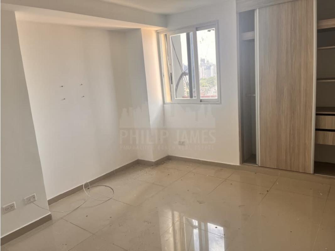 Bedroom with sliding closet doors and large window at PH Delavista Carrasquilla Panama