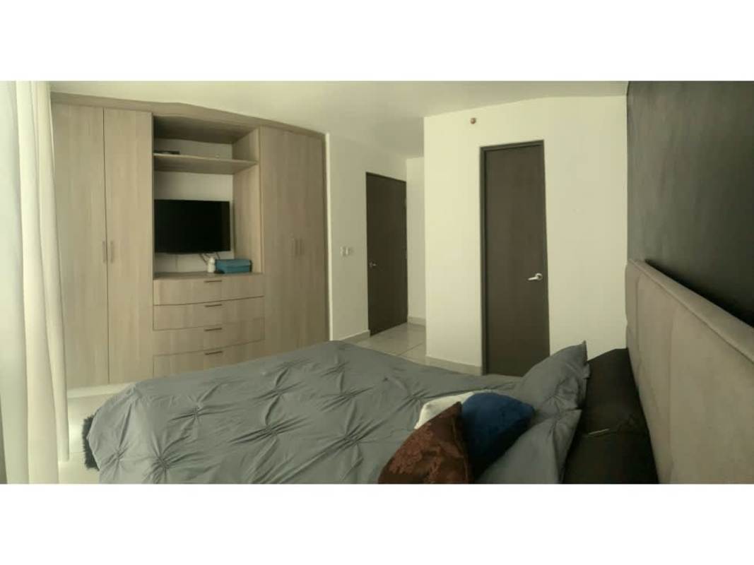 Kitchen with granite countertop, appliances, and breakfast bar in PH Metropolitan Park Panama City