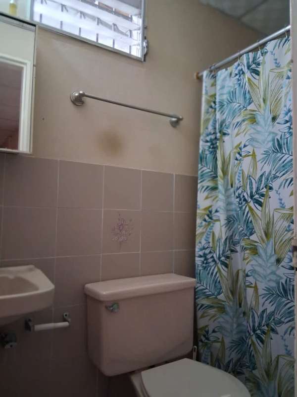 Covered balcony with neighborhood view in Condado del Rey house