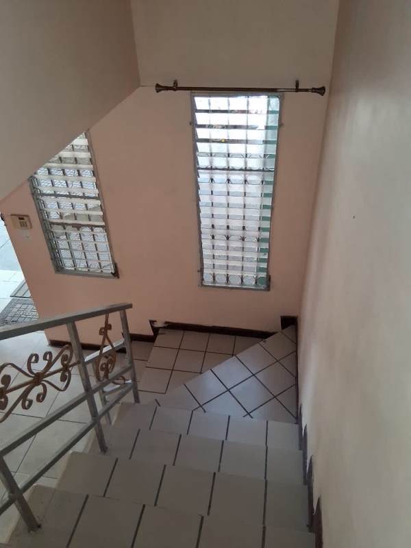 Front facade with gated entrance and parking in Condado del Rey Panama City