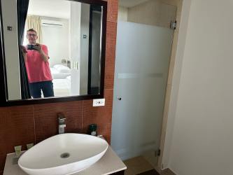 Studio apartment kitchenette with granite top and wooden cabinets Playa Blanca Resort Panama