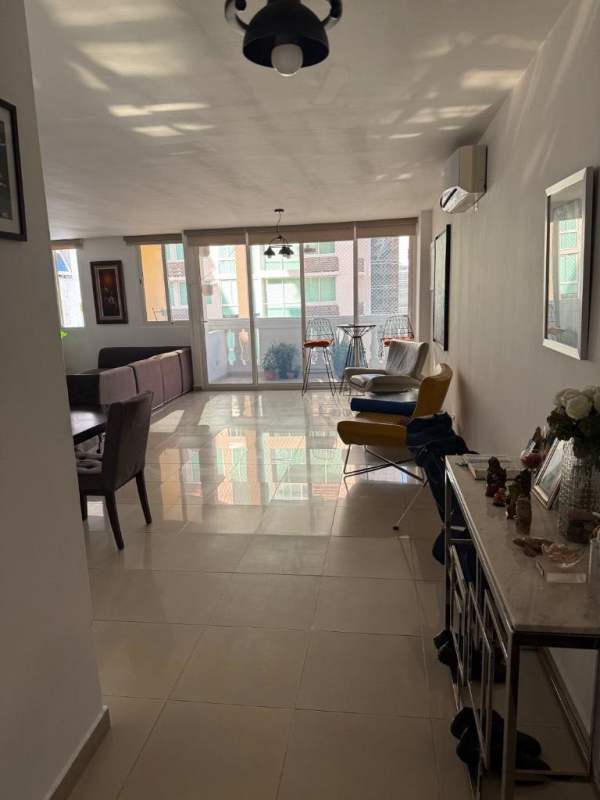 Bright living space with large windows, AC and modern furniture in apartment at Sophia Tower Obarrio Panama