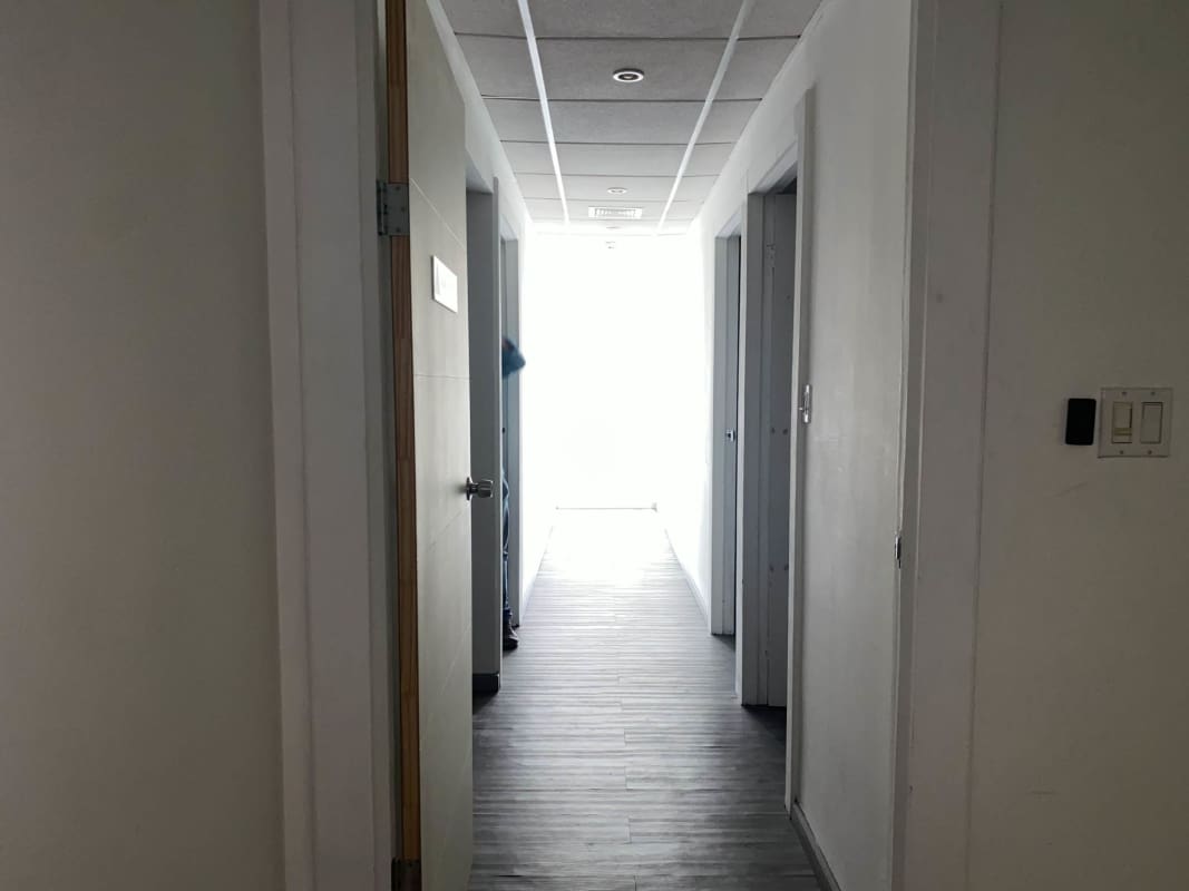 Office hallway with glass partitions and modern design in Ocean Business Plaza Marbella Panama