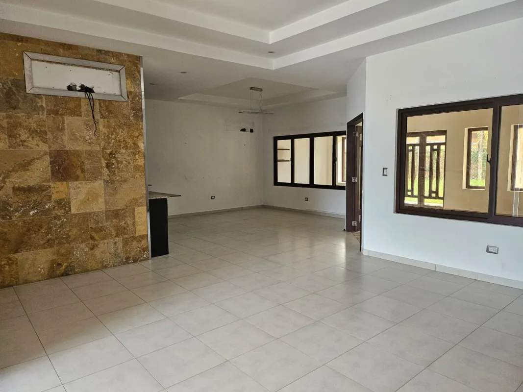 Bright empty room tile flooring in bank repo house Costa Sur Panama